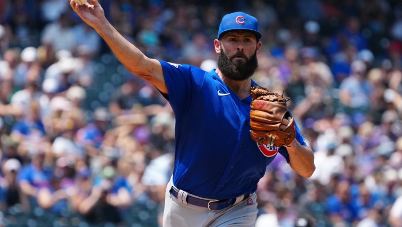 Aug 5, 2021; Denver, Colorado, USA; Chicago Cubs starting pitcher Jake Arrieta (49) throws to first base against the Colorado Rockies in the first inning at Coors Field. Mandatory Credit: Ron Chenoy-USA TODAY Sports