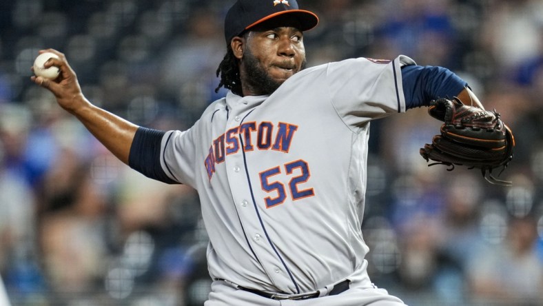 Aug 17, 2021; Kansas City, Missouri, USA; Houston Astros relief pitcher Pedro Baez (52) pitches against the Kansas City Royals during the seventh inning at Kauffman Stadium. Mandatory Credit: Jay Biggerstaff-USA TODAY Sports