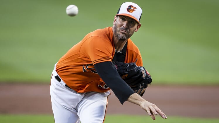 Aug 21, 2021; Baltimore, Maryland, USA; Baltimore Orioles starting pitcher Matt Harvey (32) pitches during the first inning against the Atlanta Braves at Oriole Park at Camden Yards. Mandatory Credit: Scott Taetsch-USA TODAY Sports