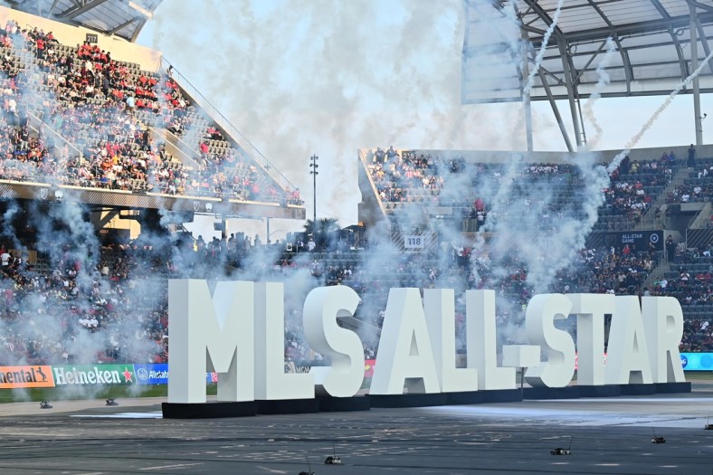 Aug 25, 2021; Los Angeles, CA, USA;   General view of fireworks behind the MLS All-Star display on the pitch before the 2021 MLS All-Star Game at Banc of California Stadium.  Mandatory Credit: Jayne Kamin-Oncea-USA TODAY Sports