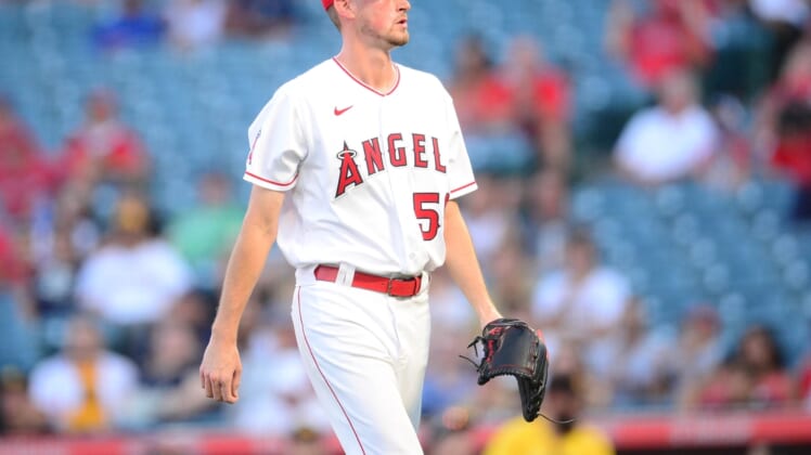 Aug 27, 2021; Anaheim, California, USA; Los Angeles Angels starting pitcher Cooper Criswell (56) after the first inning against the San Diego Padres at Angel Stadium. Mandatory Credit: Gary A. Vasquez-USA TODAY Sports