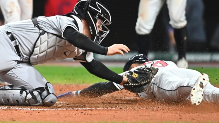 iSep 23, 2021; Cleveland, Ohio, USA; Cleveland Indians pinch runner Andres Gimenez (0) scores under the tag of Chicago White Sox catcher Zack Collins (21) during the sixth inning at Progressive Field. Mandatory Credit: Ken Blaze-USA TODAY Sports