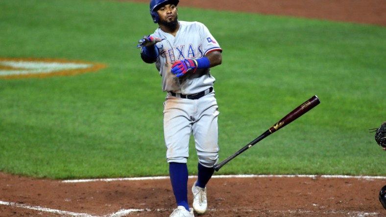 Sept. 25, 2021; Baltimore, Maryland, USA; Texas Rangers second baseman Yonny Hernandez (65) flips his bat after drawing a walk against the Baltimore Orioles during the seventh inning at Oriole Park at Camden Yards. Mandatory Credit: Daniel Kucin Jr.-USA TODAY Sports