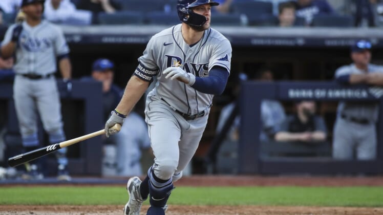 Oct 2, 2021; Bronx, New York, USA;  Tampa Bay Rays left fielder Austin Meadows (17) hits a three run home run in the seventh inning against the New York Yankees at Yankee Stadium. Mandatory Credit: Wendell Cruz-USA TODAY Sports