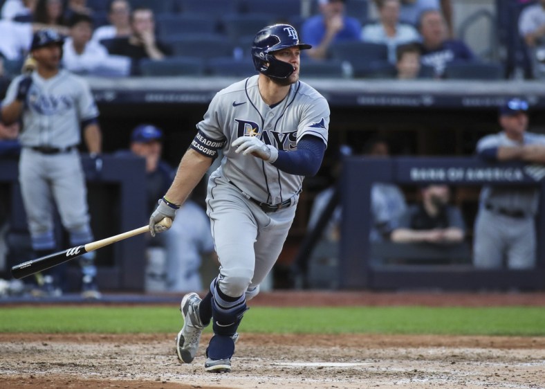 Oct 2, 2021; Bronx, New York, USA;  Tampa Bay Rays left fielder Austin Meadows (17) hits a three run home run in the seventh inning against the New York Yankees at Yankee Stadium. Mandatory Credit: Wendell Cruz-USA TODAY Sports