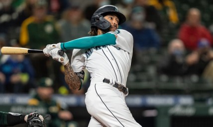 Sep 27, 2021; Seattle, Washington, USA;  Seattle Mariners rightfielder Mitch Haniger (17) takes a swing during an at-bat in a game against the Oakland Athletics at T-Mobile Park. The Mariners won 13-4. Mandatory Credit: Stephen Brashear-USA TODAY Sports