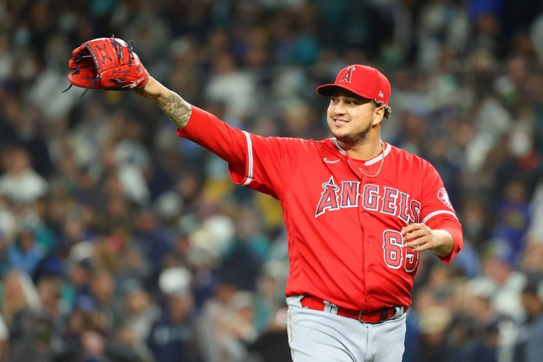 Oct 1, 2021; Seattle, Washington, USA; Los Angeles Angels relief pitcher Jose Quijada (65) reacts after forcing the final out during the bottom of the seventh inning against the Seattle Mariners at T-Mobile Park. Mandatory Credit: Abbie Parr-USA TODAY Sports