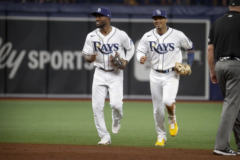 Oct 8, 2021; St. Petersburg, Florida, USA; Tampa Bay Rays left fielder Randy Arozarena (56) and shortstop Wander Franco (5) come off the field at end of the third inning against the Boston Red Sox in game two of the 2021 ALDS at Tropicana Field. Mandatory Credit: Kim Klement-USA TODAY Sports