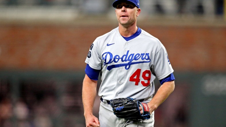 Oct 23, 2021; Cumberland, Georgia, USA; Los Angeles Dodgers relief pitcher Blake Treinen (49) reacts after a strike out during the sixth inning against the Atlanta Braves in game six of the 2021 NLCS at Truist Park. Mandatory Credit: Brett Davis-USA TODAY Sports