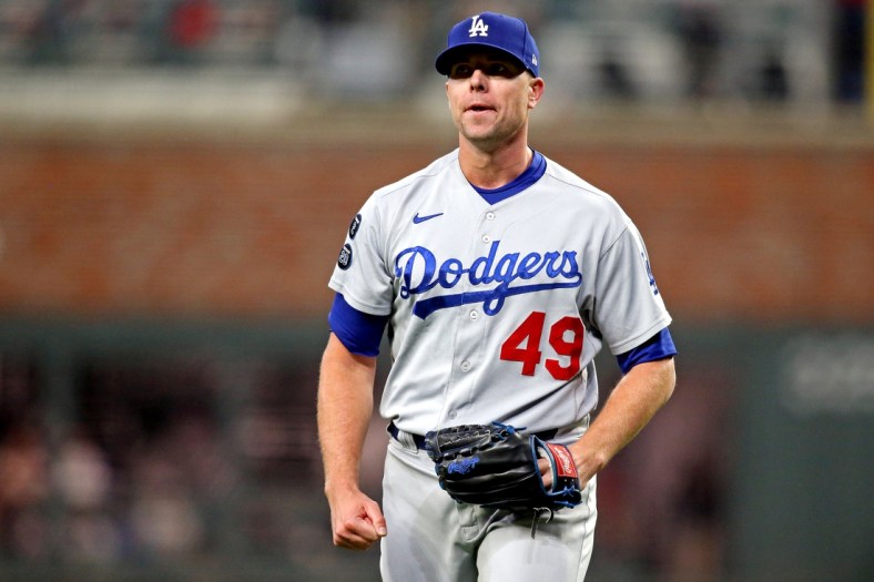 Oct 23, 2021; Cumberland, Georgia, USA; Los Angeles Dodgers relief pitcher Blake Treinen (49) reacts after a strike out during the sixth inning against the Atlanta Braves in game six of the 2021 NLCS at Truist Park. Mandatory Credit: Brett Davis-USA TODAY Sports