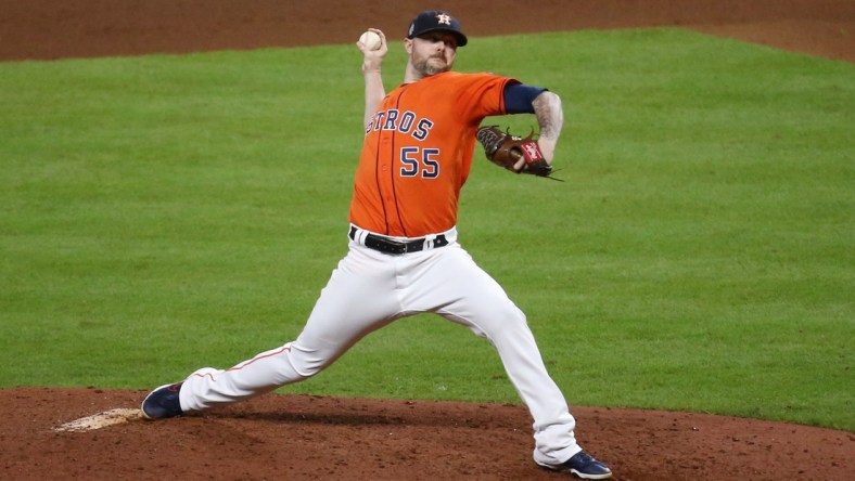 Oct 27, 2021; Houston, TX, USA; Houston Astros relief pitcher Ryan Pressly throws a pitch against the Atlanta Braves during the eighth inning in game two of the 2021 World Series at Minute Maid Park. Mandatory Credit: Troy Taormina-USA TODAY Sports