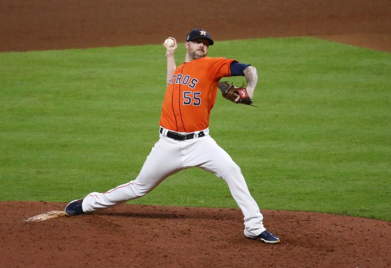Oct 27, 2021; Houston, TX, USA; Houston Astros relief pitcher Ryan Pressly throws a pitch against the Atlanta Braves during the eighth inning in game two of the 2021 World Series at Minute Maid Park. Mandatory Credit: Troy Taormina-USA TODAY Sports