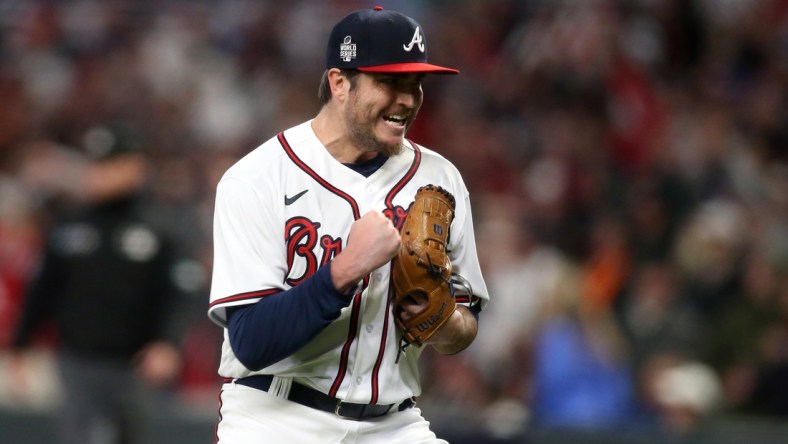 Oct 30, 2021; Atlanta, Georgia, USA; Atlanta Braves relief pitcher Luke Jackson (77) reacts to the third out of the eighth inning of game four of the 2021 World Series against the Houston Astros at Truist Park. Mandatory Credit: Brett Davis-USA TODAY Sports