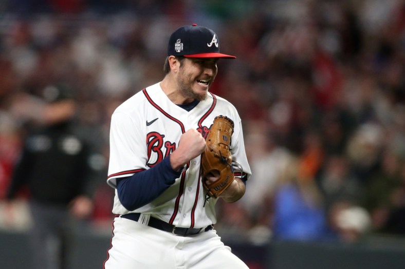 Oct 30, 2021; Atlanta, Georgia, USA; Atlanta Braves relief pitcher Luke Jackson (77) reacts to the third out of the eighth inning of game four of the 2021 World Series against the Houston Astros at Truist Park. Mandatory Credit: Brett Davis-USA TODAY Sports