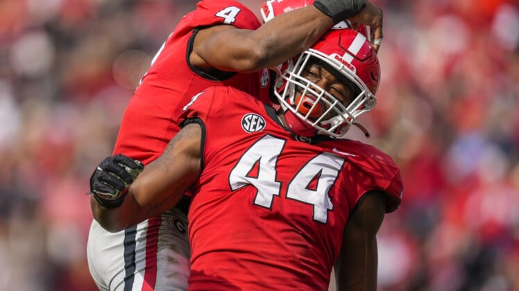 Nov 6, 2021; Athens, Georgia, USA; Georgia Bulldogs defensive lineman Travon Walker (44) reacts with linebacker Nolan Smith (4) after a sack against the Missouri Tigers during the second half at Sanford Stadium. Mandatory Credit: Dale Zanine-USA TODAY Sports