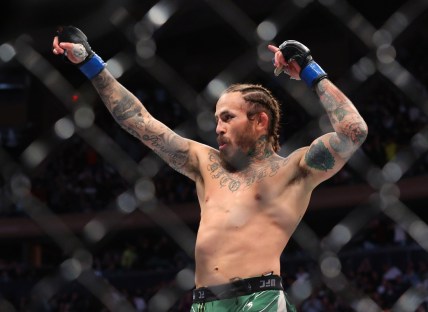 Nov 6, 2021; New York, NY, USA; Marlon Vera (blue gloves) celebrates after defeating Frankie Edgar (red gloves) during UFC 268 at Madison Square Garden. Mandatory Credit: Ed Mulholland-USA TODAY Sports