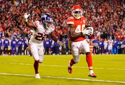 Nov 1, 2021; Kansas City, Missouri, USA; Kansas City Chiefs running back Derrick Gore (40) runs for a touchdown against New York Giants cornerback Adoree' Jackson (22) during the first half at GEHA Field at Arrowhead Stadium. Mandatory Credit: Jay Biggerstaff-USA TODAY Sports