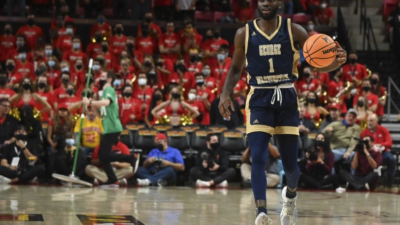 Nov 11, 2021; College Park, Maryland, USA;  George Washington Colonials guard Joe Bamisile (1) dribbles up the court during the game against the Maryland Terrapins at Xfinity Center. Mandatory Credit: Tommy Gilligan-USA TODAY Sports