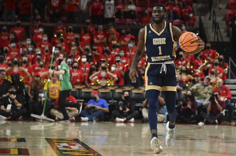 Nov 11, 2021; College Park, Maryland, USA;  George Washington Colonials guard Joe Bamisile (1) dribbles up the court during the game against the Maryland Terrapins at Xfinity Center. Mandatory Credit: Tommy Gilligan-USA TODAY Sports