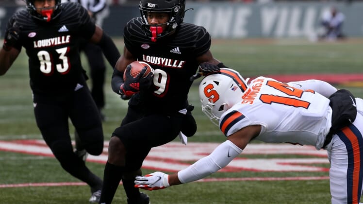 Louisville's Tyler Harrell makes Syracuse's Jason Simmons miss the tackle after he catches the ball and then runs for a touchdown. Nov. 13, 2021 Louisville Syracuse 18