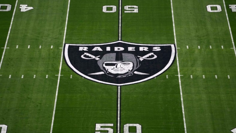 Nov 14, 2021; Paradise, Nevada, USA; A detailed view of the Las Vegas Raiders shield logo at midfield at Allegiant Stadium. Mandatory Credit: Kirby Lee-USA TODAY Sports