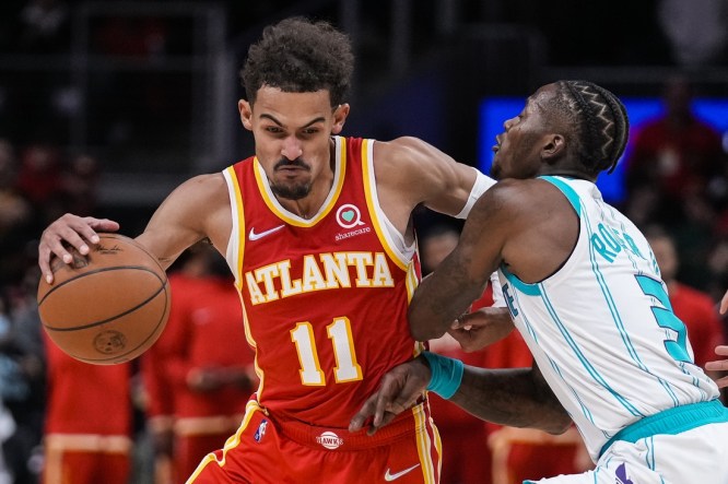 Nov 20, 2021; Atlanta, Georgia, USA; Atlanta Hawks guard Trae Young (11) dribbles against Charlotte Hornets guard Terry Rozier (3) during the second half at State Farm Arena. Mandatory Credit: Dale Zanine-USA TODAY Sports