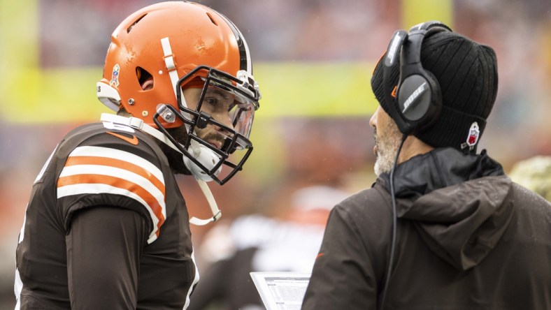 Nov 21, 2021; Cleveland, Ohio, USA; Cleveland Browns quarterback Baker Mayfield (6) talks with head coach Kevin Stefanski during the first quarter against the Detroit Lions at FirstEnergy Stadium. Mandatory Credit: Scott Galvin-USA TODAY Sports