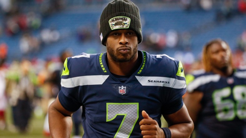 Nov 21, 2021; Seattle, Washington, USA; Seattle Seahawks quarterback Geno Smith (7) jogs to the locker room following a 23-13 loss against the Arizona Cardinals at Lumen Field. Mandatory Credit: Joe Nicholson-USA TODAY Sports