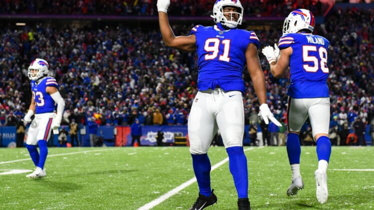 Dec 6, 2021; Orchard Park, New York, USA; Buffalo Bills defensive tackle Ed Oliver (91) reacts to a defensive play against the New England Patriots during the first half at Highmark Stadium. Mandatory Credit: Rich Barnes-USA TODAY Sports