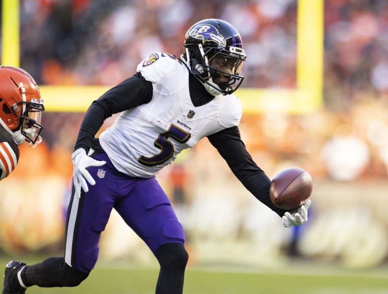 Dec 12, 2021; Cleveland, Ohio, USA; Baltimore Ravens wide receiver Marquise Brown (5) makes a one-handed catch against the Cleveland Browns during the fourth quarter at FirstEnergy Stadium. Mandatory Credit: Scott Galvin-USA TODAY Sports