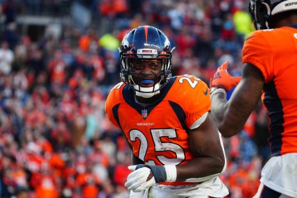 Dec 12, 2021; Denver, Colorado, USA; Denver Broncos running back Melvin Gordon III (25) reacts following his touchdown carry in the third quarter against the Detroit Lions at Empower Field at Mile High. Mandatory Credit: Ron Chenoy-USA TODAY Sports