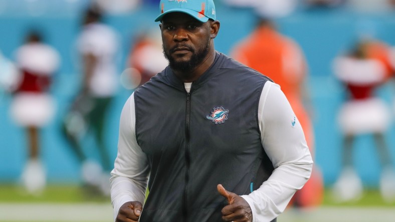 Dec 19, 2021; Miami Gardens, Florida, USA; Miami Dolphins head coach Brian Flores runs off the field after winning the game against the New York Jets at Hard Rock Stadium. Mandatory Credit: Sam Navarro-USA TODAY Sports