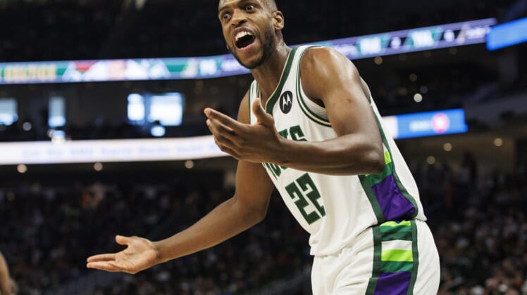 Dec 25, 2021; Milwaukee, Wisconsin, USA;  Milwaukee Bucks forward Khris Middleton (22) reacts after being called for a foul during the second quarter against tbe Boston Celtics at Fiserv Forum. Mandatory Credit: Jeff Hanisch-USA TODAY Sports