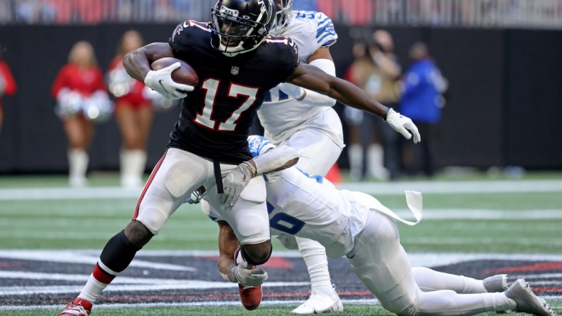 Dec 26, 2021; Atlanta, Georgia, USA; Atlanta Falcons wide receiver Olamide Zaccheaus (17) runs after a catch against Detroit Lions cornerback Ifeatu Melifonwu (26) during the first half at Mercedes-Benz Stadium. Mandatory Credit: Jason Getz-USA TODAY Sports