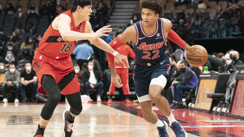 Dec 28, 2021; Toronto, Ontario, CAN; Philadelphia 76ers guard Matisse Thybulle (22) controls the ball as Toronto Raptors forward Yuta Watanabe (18) tries to defend during the first quarter at Scotiabank Arena. Mandatory Credit: Nick Turchiaro-USA TODAY Sports