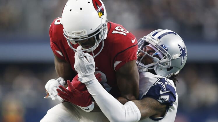Jan 2, 2022; Arlington, Texas, USA; Arizona Cardinals wide receiver A.J. Green (18) catches a pass against Dallas Cowboys cornerback Trevon Diggs (7) in the first quarter at AT&T Stadium. Mandatory Credit: Tim Heitman-USA TODAY Sports