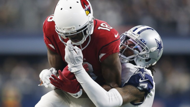 Jan 2, 2022; Arlington, Texas, USA; Arizona Cardinals wide receiver A.J. Green (18) catches a pass against Dallas Cowboys cornerback Trevon Diggs (7) in the first quarter at AT&T Stadium. Mandatory Credit: Tim Heitman-USA TODAY Sports