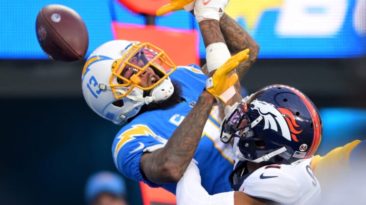 Jan 2, 2022; Inglewood, California, USA; Denver Broncos safety Kareem Jackson (22) breaks up a pass in the end zone for Los Angeles Chargers wide receiver Keenan Allen (13) in the second half the game at SoFi Stadium. Mandatory Credit: Jayne Kamin-Oncea-USA TODAY Sports