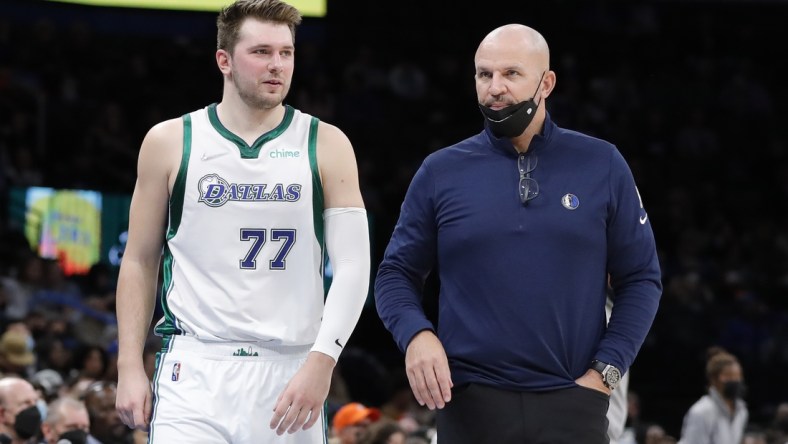 Jan 2, 2022; Oklahoma City, Oklahoma, USA; Dallas Mavericks guard Luka Doncic (77) and head coach Jason Kidd (right) talk between plays against the Oklahoma City Thunder during the second quarter at Paycom Center. Mandatory Credit: Alonzo Adams-USA TODAY Sports