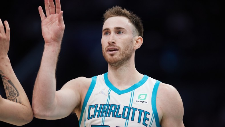 Jan 5, 2022; Charlotte, North Carolina, USA; Charlotte Hornets forward Gordon Hayward (20) high fives a teammate during second half action against the Detroit Pistons at Spectrum Center. Mandatory Credit: Brian Westerholt-USA TODAY Sports