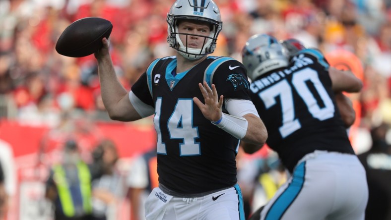 Jan 9, 2022; Tampa, Florida, USA; Carolina Panthers quarterback Sam Darnold (14) throws the ball against the Tampa Bay Buccaneers during the first quarter at Raymond James Stadium. Mandatory Credit: Kim Klement-USA TODAY Sports