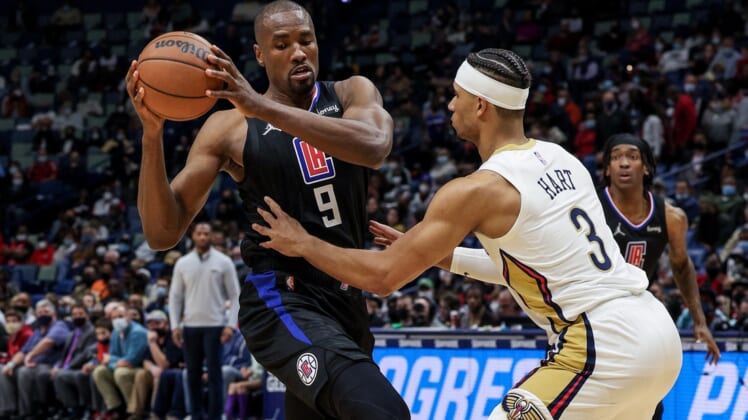 Jan 13, 2022; New Orleans, Louisiana, USA;  LA Clippers center Serge Ibaka (9) controls the ball against New Orleans Pelicans guard Josh Hart (3) during the second half at the Smoothie King Center. Mandatory Credit: Stephen Lew-USA TODAY Sports