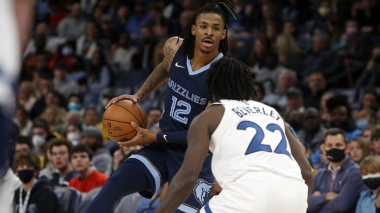 Jan 13, 2022; Memphis, Tennessee, USA; Memphis Grizzles guard Ja Morant (12) looks for an open lane during the second half against the Minnesota Timberwolves at FedExForum. Mandatory Credit: Petre Thomas-USA TODAY Sports