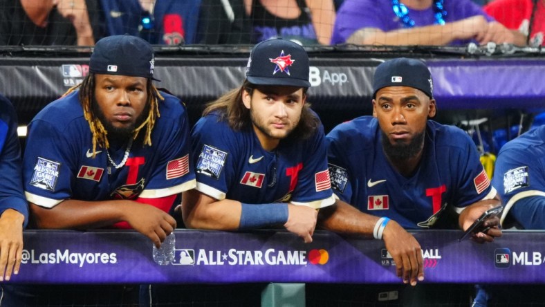 Jul 13, 2021; Denver, Colorado, USA; Toronto Blue Jays first baseman Vladimir Guerrero Jr. (left) shortstop Bo Bichette (center) and outfielder Teoscar Hernandez during the 2021 MLB All Star Game at Coors Field. Mandatory Credit: Mark J. Rebilas-USA TODAY Sports