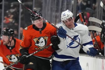 Jan 21, 2022; Anaheim, California, USA; Anaheim Ducks right wing Buddy Robinson (53) checks Tampa Bay Lightning defenseman Cal Foote (52) into the boards in the third period at Honda Center. Mandatory Credit: Kirby Lee-USA TODAY Sports