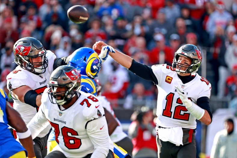 Jan 23, 2022; Tampa, Florida, USA; Tampa Bay Buccaneers quarterback Tom Brady (12) throws a pass during the first half against the Los Angeles Rams in a NFC Divisional playoff football game at Raymond James Stadium. Mandatory Credit: Matt Pendleton-USA TODAY Sports