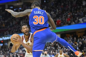 Jan 24, 2022; Cleveland, Ohio, USA; New York Knicks forward Julius Randle (30) defends Cleveland Cavaliers center Evan Mobley (4) in the fourth quarter at Rocket Mortgage FieldHouse. Mandatory Credit: David Richard-USA TODAY Sports