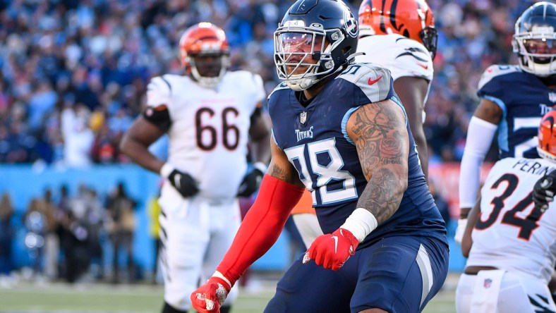 Jan 22, 2022; Nashville, Tennessee, USA; Tennessee Titans defensive tackle Jeffery Simmons (98) celebrates during an AFC Divisional playoff football game at Nissan Stadium. Mandatory Credit: Steve Roberts-USA TODAY Sports