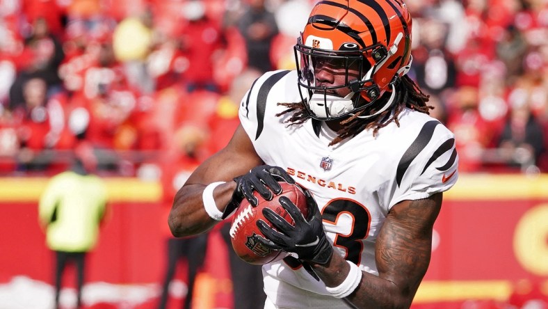 Jan 30, 2022; Kansas City, Missouri, USA; Cincinnati Bengals cornerback Tre Flowers (33) warms up before the AFC Championship Game against the Kansas City Chiefs at GEHA Field at Arrowhead Stadium. Mandatory Credit: Denny Medley-USA TODAY Sports