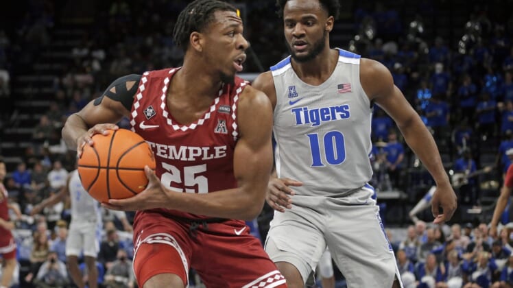 Feb 24, 2022; Memphis, Tennessee, USA; Temple Owls guard Jeremiah Williams (25) looks to pass the ball as Memphis Tigers guard Alex Lomax (10) defends during the first half at FedExForum. Mandatory Credit: Petre Thomas-USA TODAY Sports